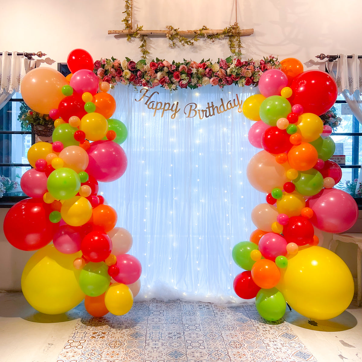 Floral + Balloon Garland on Curtain Backdrop Style It Simply