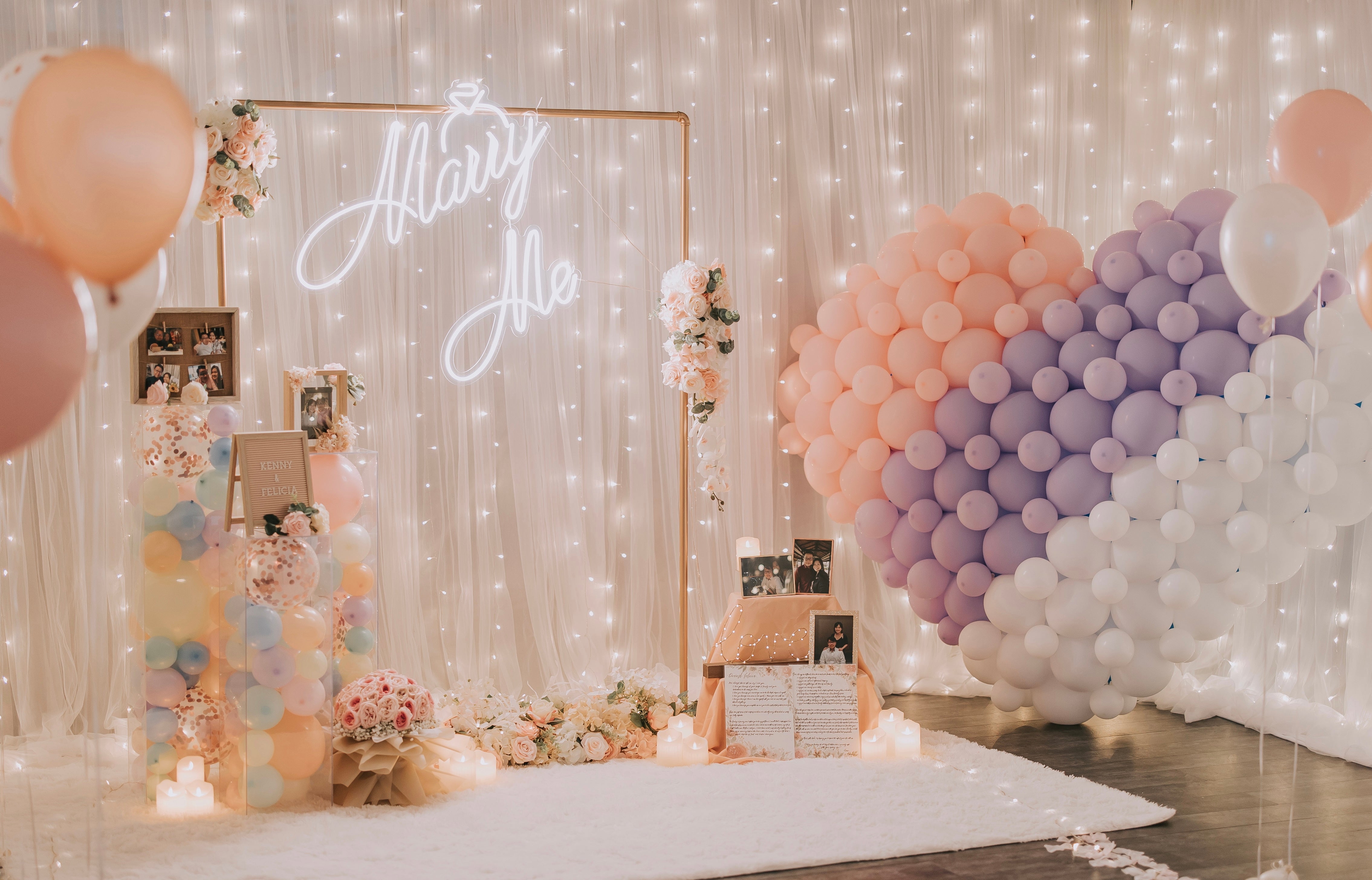 Romantic Hotel Room Proposal Decor in Singapore with Fairylight Backdrop, Pastel Balloons, Flowers and Neon Sign by Style It Simply