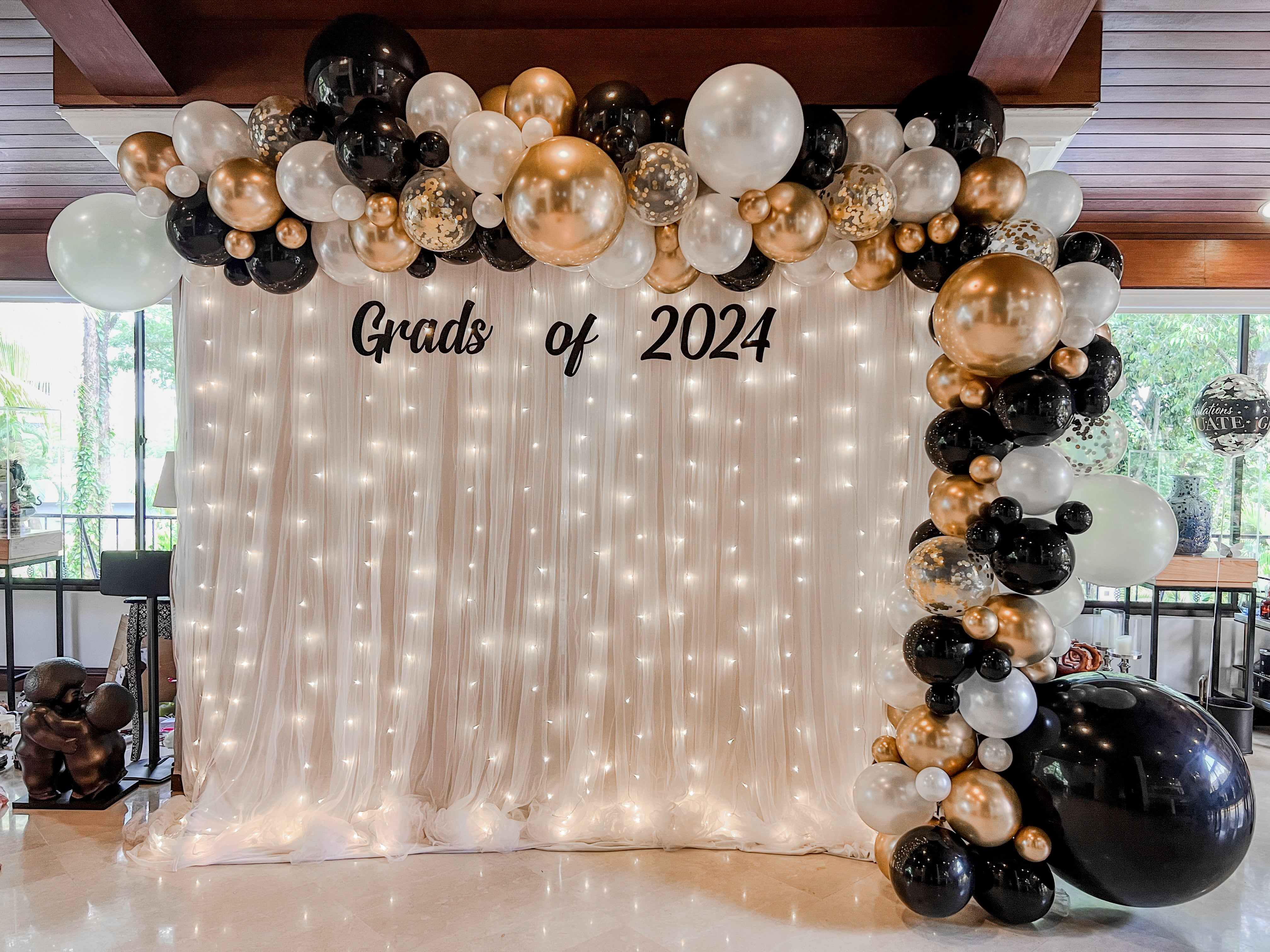 XL Signature Balloon Garland on Curtain Backdrop