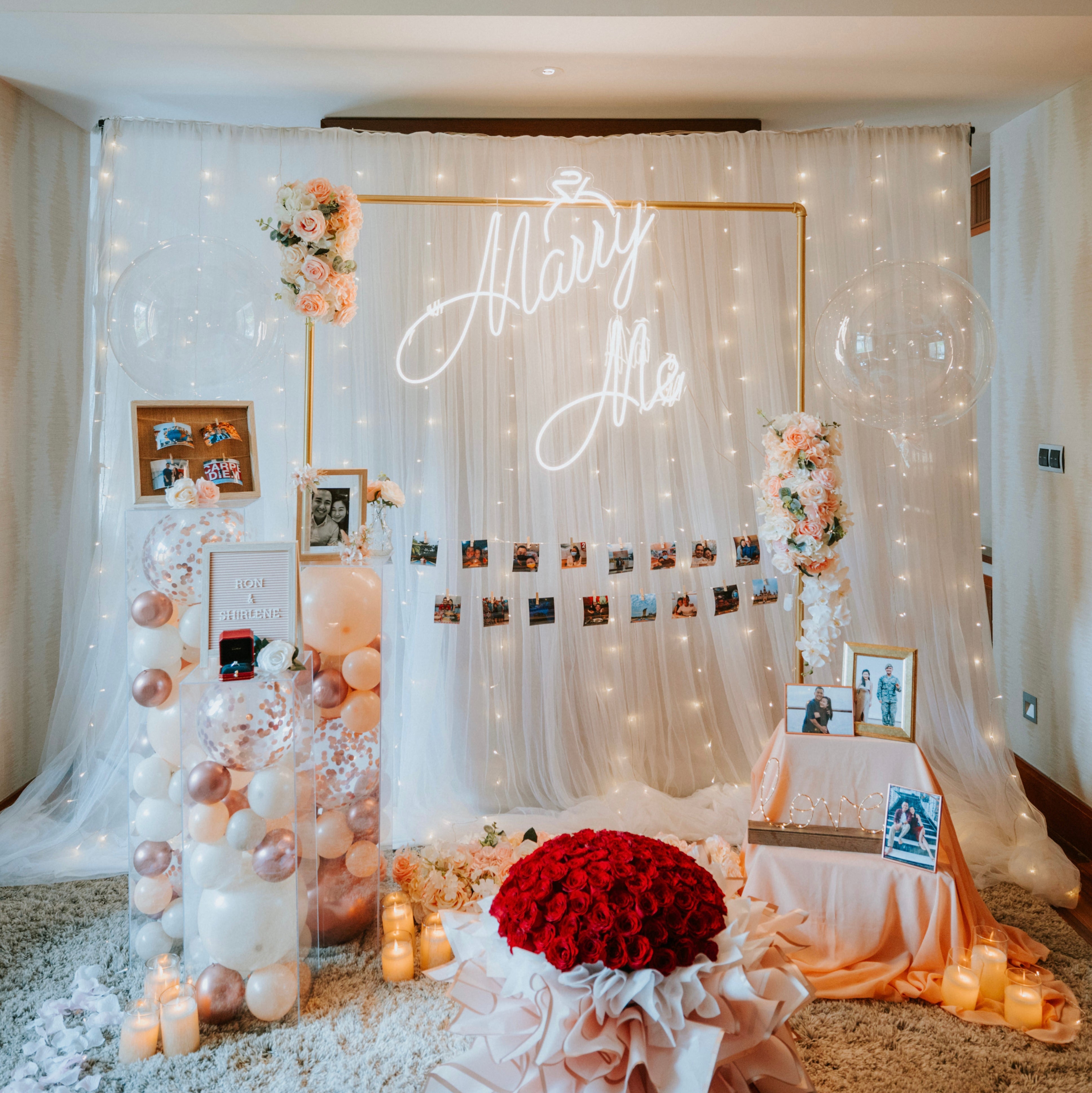 Romantic Hotel Room Proposal Decor in Sofitel Singapore Sentosa with Fairylight Backdrop, Pastel Balloons, Flowers and Neon Sign by Style It Simply