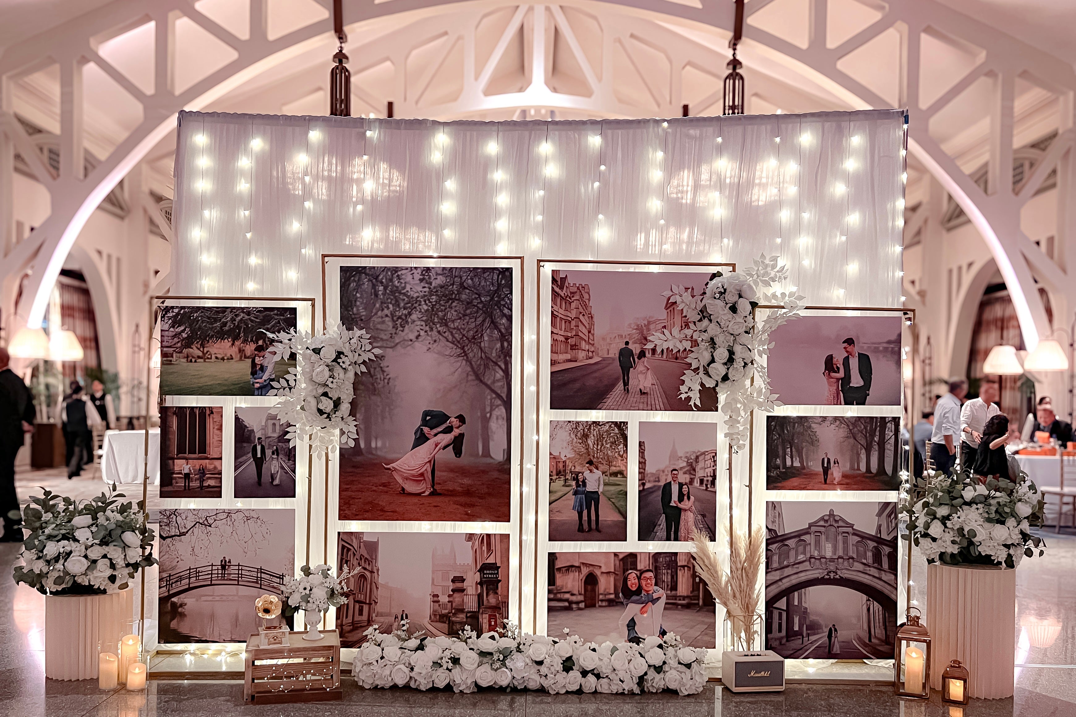 Wedding Reception Decor in Singapore - Multi-stands Photo Gallery with White Florals (Venue: The Fullerton Bay Hotel Clifford Pier)