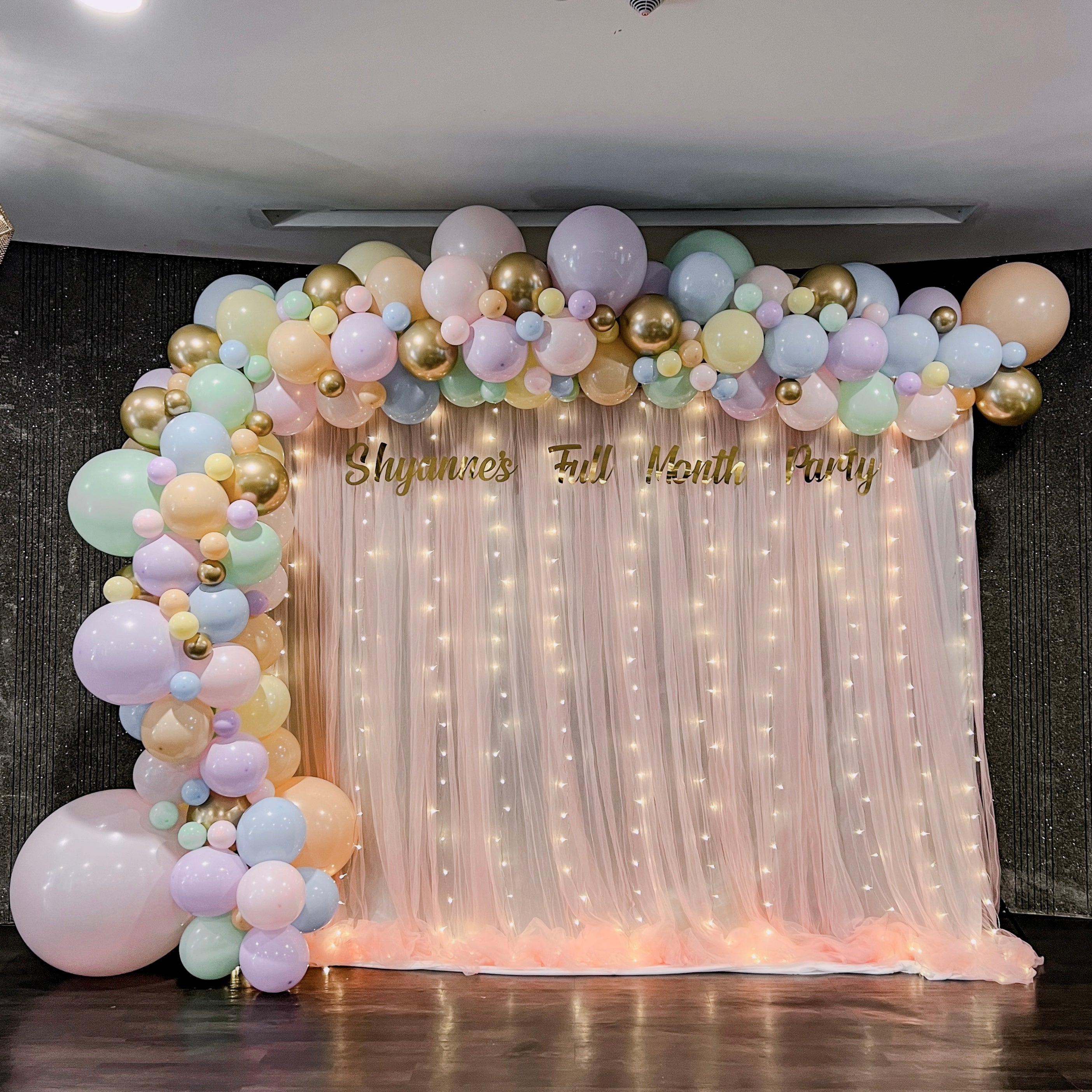 XL Signature Balloon Garland on Curtain Backdrop