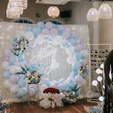 Romantic Proposal Decor at Norris House in Singapore with Fairylight Backdrop, Round Balloon Arch, Marry Me Neon Signage, Bubble Lights and Flowers by Style It Simply