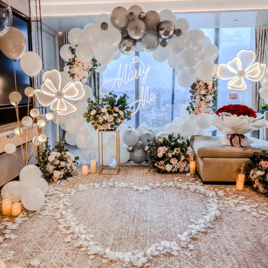 Romantic Hotel Room Proposal Decor at Marina Bay Sands Singapore with Round Balloon Arch, Marry Me Neon Signage, Bubble Lights, Giant Heart Shape Balloon Sculpture and Flowers by Style It Simply