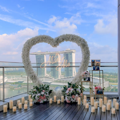 Romantic Outdoor Proposal Decor at VUE Singapore with Heart Shape Floral Arch, LED Candles and MBS View by Style It Simply