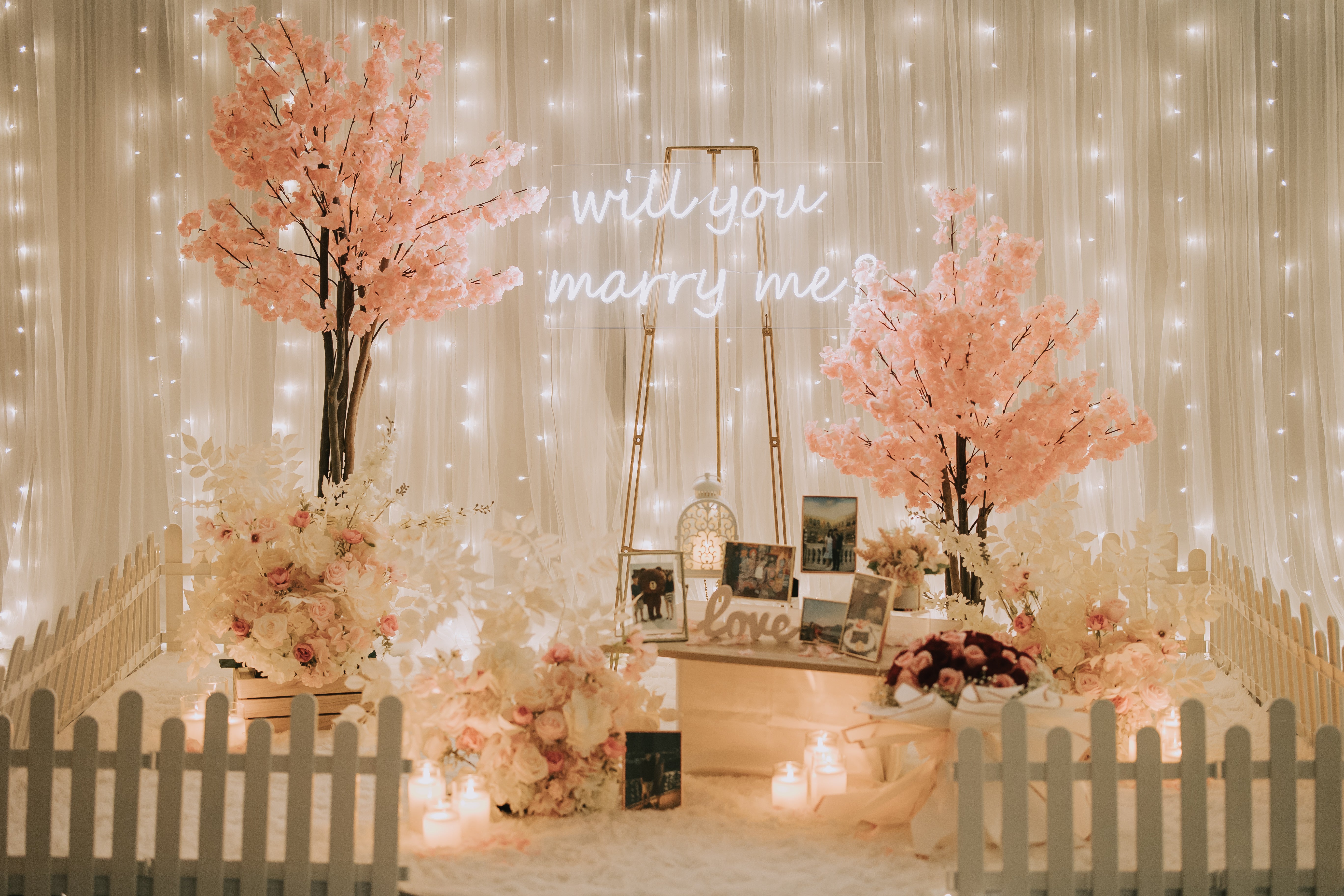 Romantic Proposal Decor in Singapore with Fairylight Backdrop, Cherry Blossoms, Flowers and Neon Sign at Haus of Feel's Indoor Studio by Style It Simply