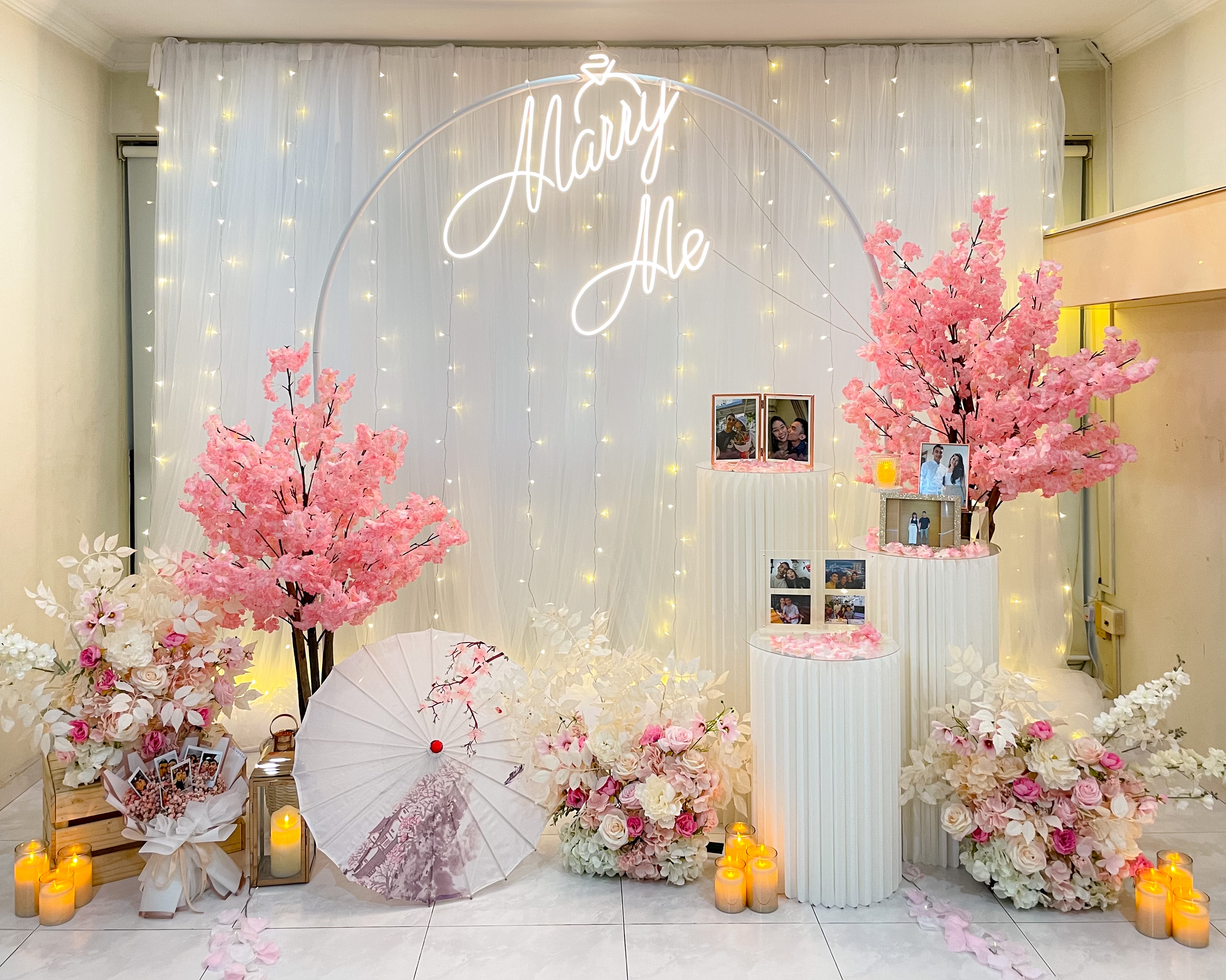 Romantic Home Proposal Decor in Singapore with Fairylight Backdrop, Cherry Blossoms, Flowers and Neon Sign by Style It Simply