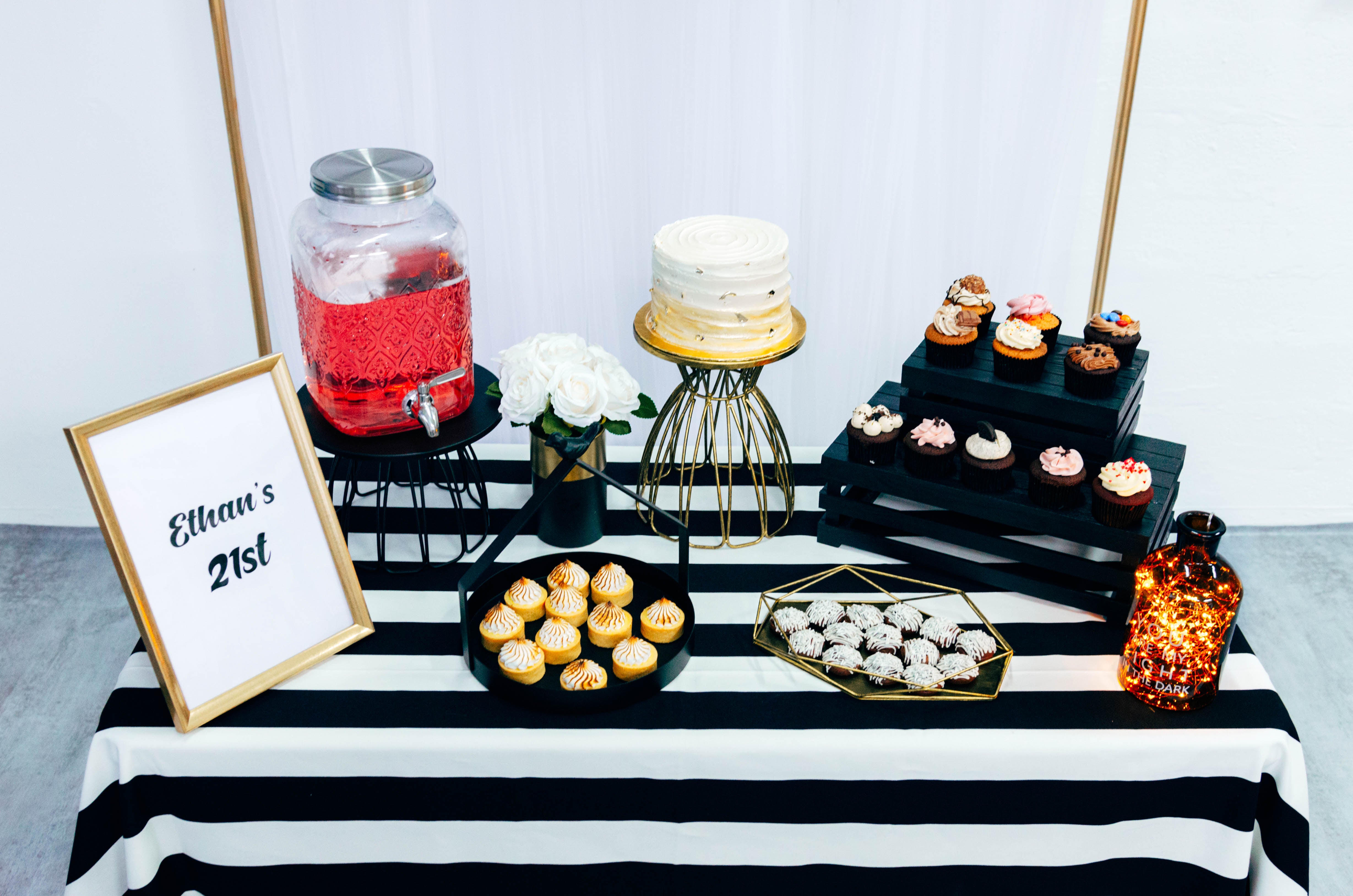 Contemporary Dessert Table in White, Black, Gold for Birthday Party by Style It Simply
