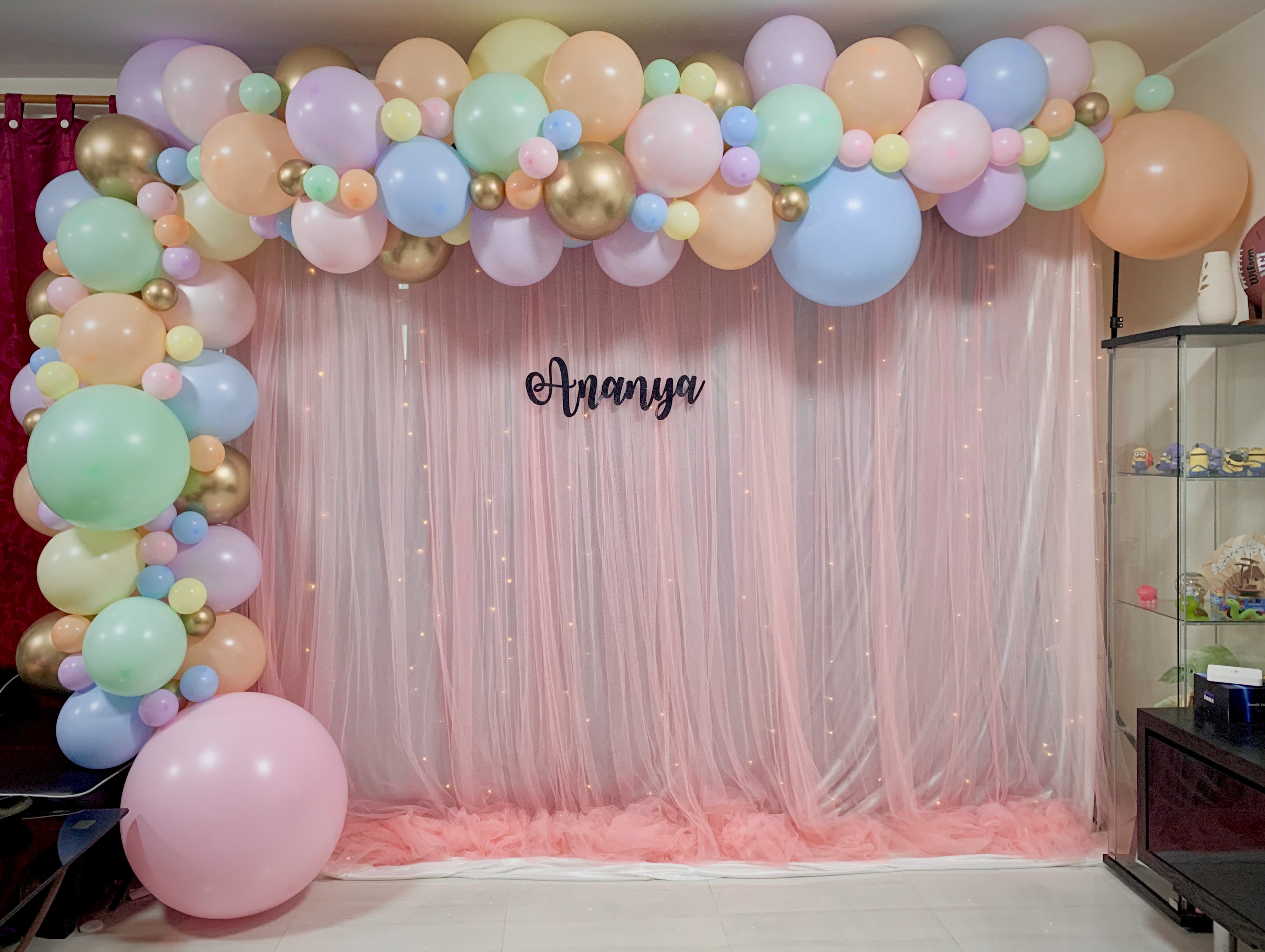 XL Signature Balloon Garland on Curtain Backdrop