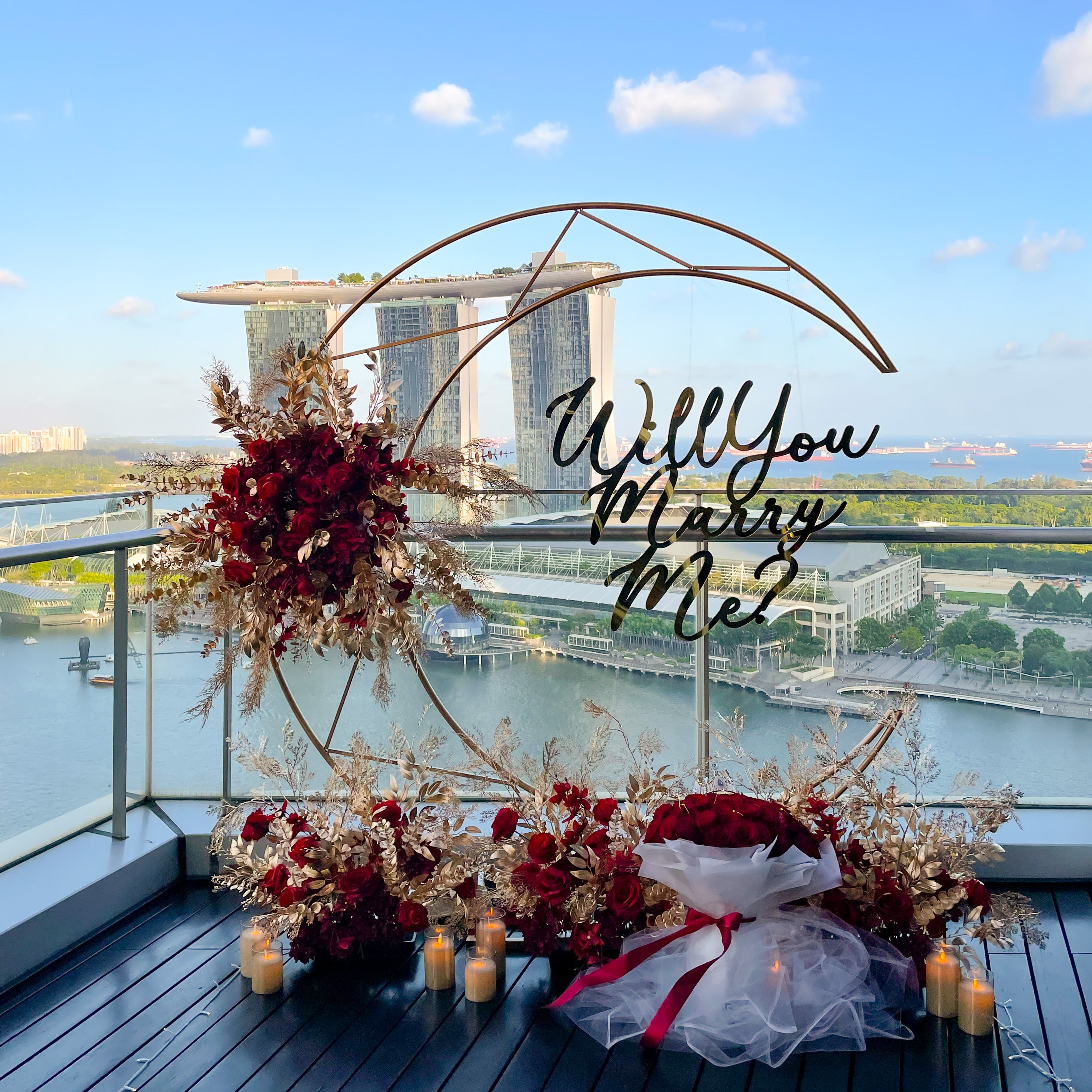 Romantic Outdoor Proposal Decor at VUE Singapore with Moon Shape Floral Arch and MBS View